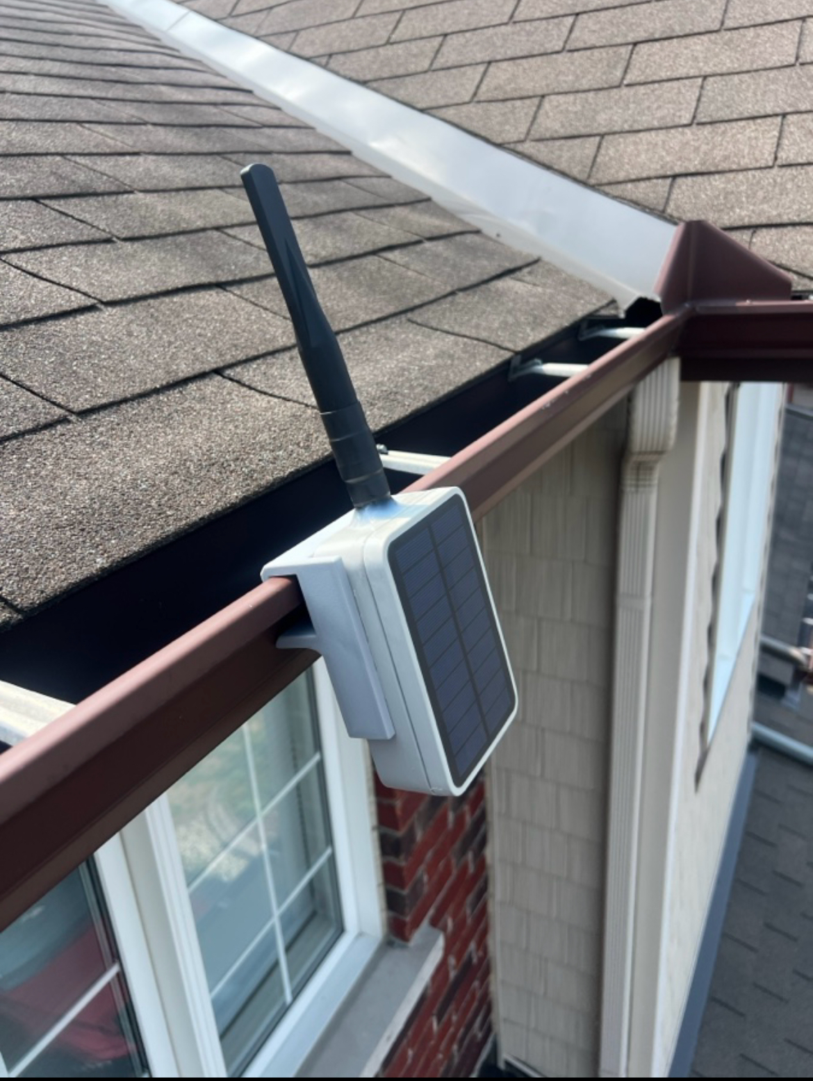 A RAK Unify enclosure installed with a community-designed gutter mount