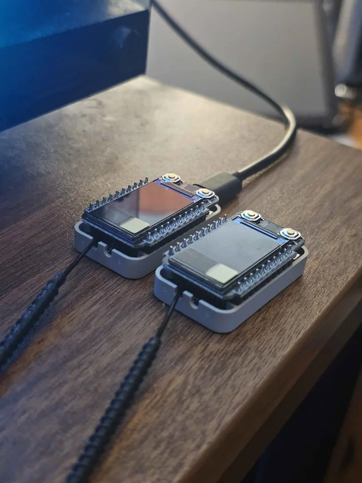 Two compact RadioCore RCC6 devices with attached landscape TFTs